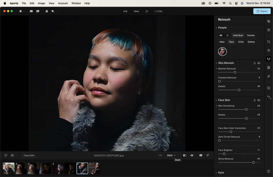 Person with closed eyes and colorful hair touches fur collar. Photo editing software interface visible with retouching options.