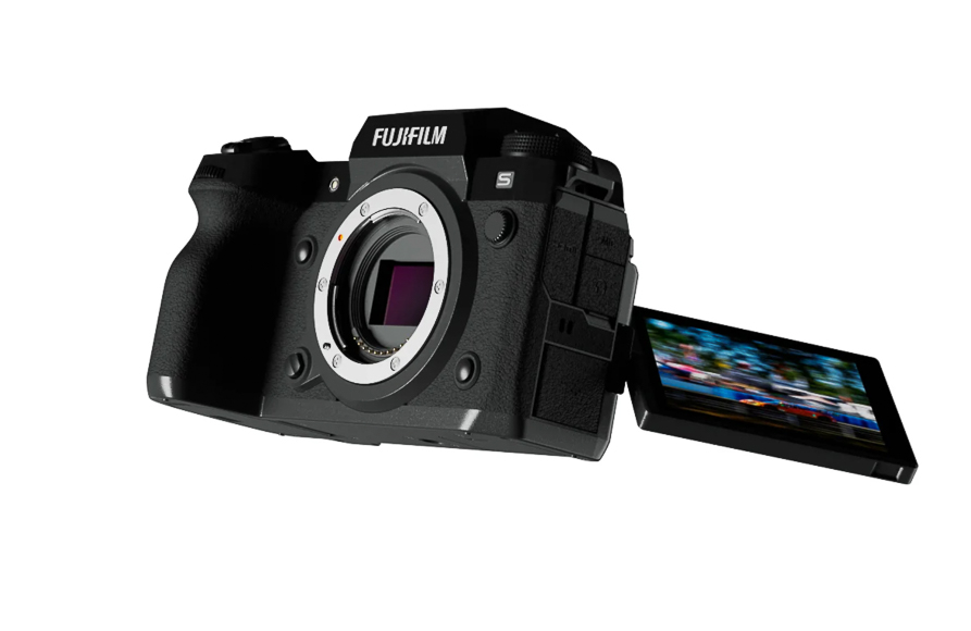 Fujifilm mirrorless camera with an open, tilted LCD screen displaying a blurred action image. The lens is not attached.