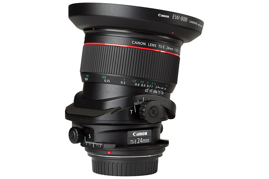 Canon TS-E 24mm f/3.5L II tilt-shift lens, featuring knobs for tilt, shift, and rotation adjustments, with a red ring indicating its L-series high-quality build.