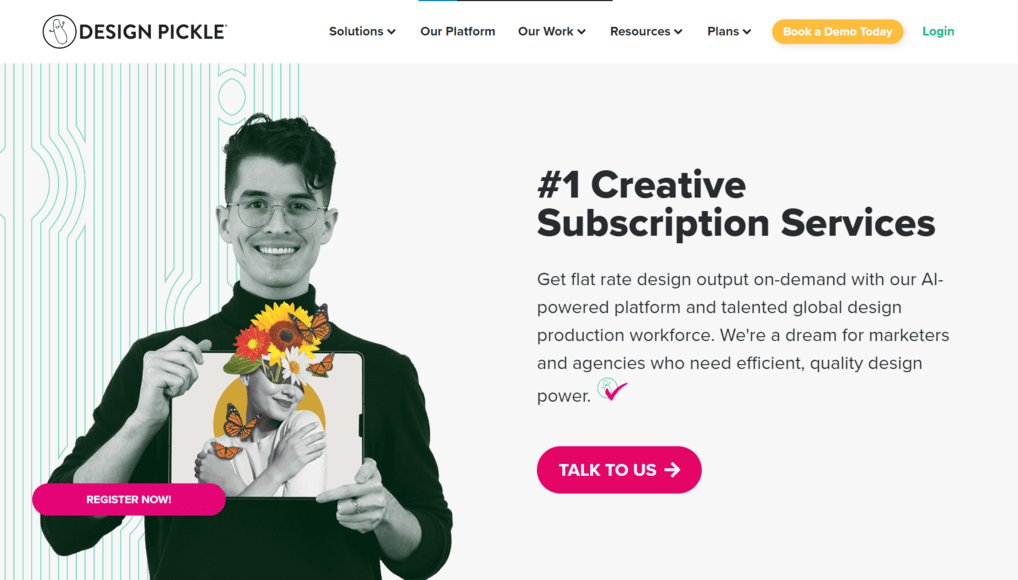 A young man holding a tablet with a creative floral design. Text: "Design Pickle. #1 Creative Subscription Services. Flat rate design output on-demand." Two buttons: "Register Now" and "Talk to Us".