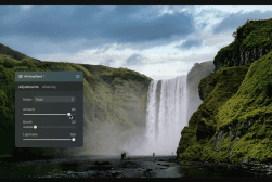 A photo editing interface with "Atmosphere" adjustments is shown over an image of a large waterfall surrounded by green cliffs under a cloudy sky.